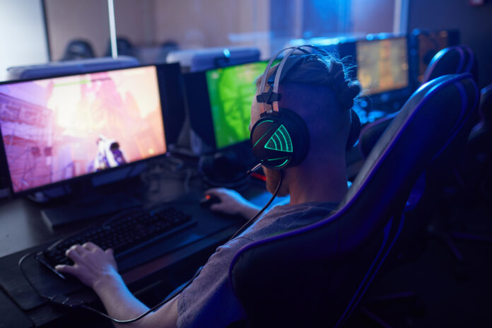 Gamer playing computer game